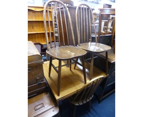 A SET OF FOUR ERCOL SPINDLE BACK DINING CHAIRS
