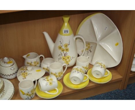 CARLTONWARE TEASET, decorated with yellow flowers on cream ground (17)