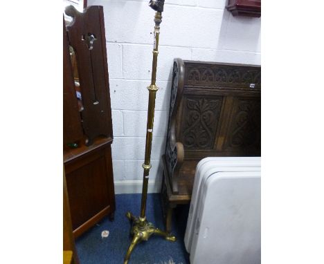 A BRASS TELESCOPIC STANDARD LAMP, with tripod base and shade