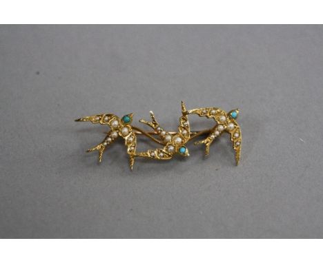 A VICTORIAN 15CT SEED PEARL SWALLOW BROOCH