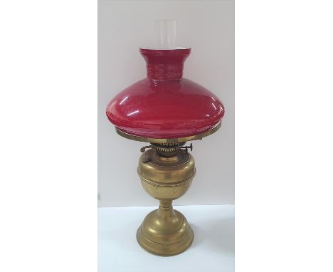 Duplex oil lamp with red glass shade 