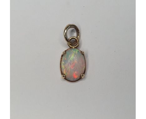 Opal pendent set in unmarked gold surround 