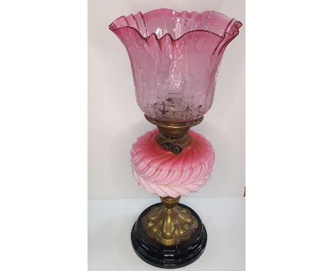 Stunning Victorian etched Cranberry glass oil lamp with pink glass font, brass pedestal set on an ebonised wood base. The lam