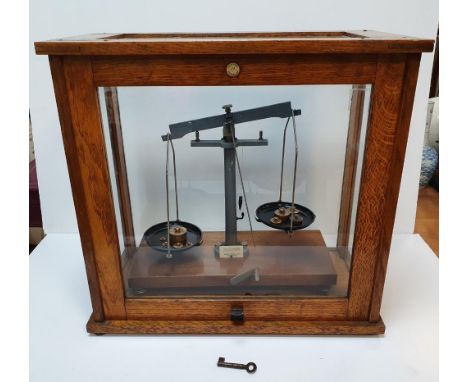 Cased set of balance scales (complete) by Phillip Harrison of Birmingham,46 cm long,Small crack to glass 