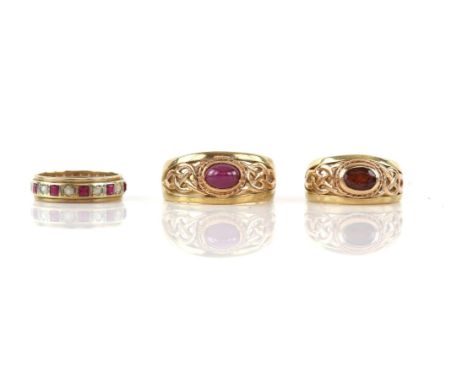 Three rings, including, a Celtic style ring, in a rub over setting, with an oval cabochon ruby, ring size V,  with another Ce