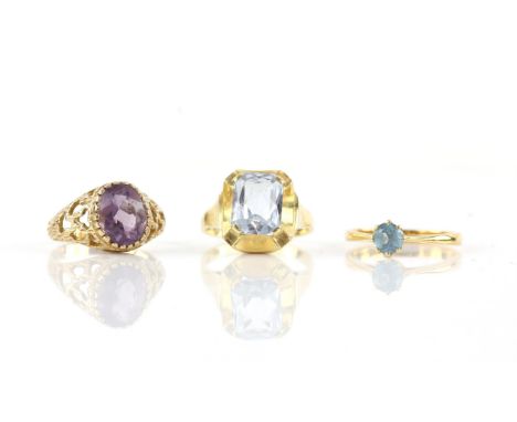 Three rings, including one round cut blue topaz ring, mounted in 22 ct yellow gold, ring size M 1/2, another blue synthetic s
