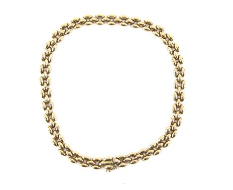 Vintage three row oval brick link necklet, with concealed clasp and figure of eight safety catch, in 9 ct yellow gold, hallma