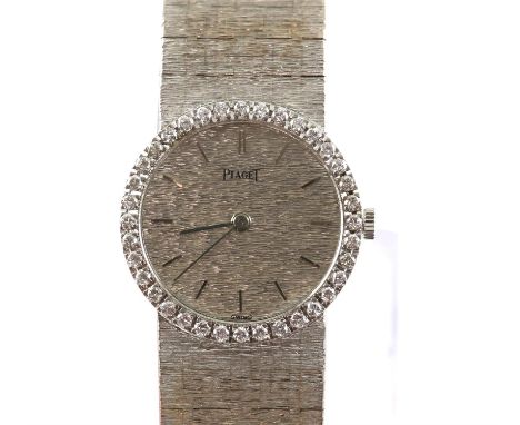 Piaget, reference 926 A6 REF 926 A6, in 18 ct white gold with a diamond set bezel, the signed white gold wave dial with baton