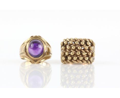 Two rings, a vintage cabochon cut amethyst ring, hallmarked London 1968, ring size Q1/2, and a keeper style knot ring, size T