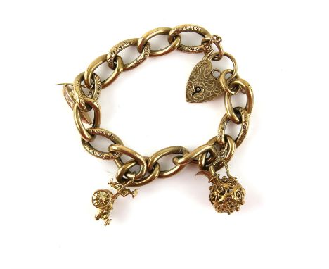 Vintage gold charm bracelet with hollow curb links and heart padlock clasp, alternate links and clasp engraved with a floral 