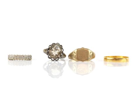 Selection of four rings, including a 3mm wedding band in 22 ct yellow gold, ring size Q, a diamond illusion set ring, size K,