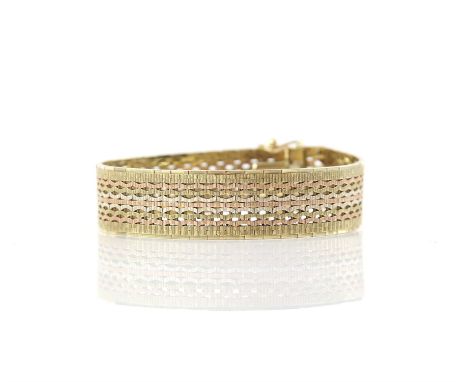 Vintage bracelet, with a fancy brick link design, in stamped 9 ct, yellow, white and rose gold, with a tongue clip clasp and 