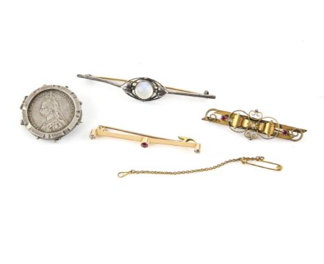 Four brooches, including, an Edwardian ornate bar brooch set with two rubies and a small rose cut diamond to the centre, in 1