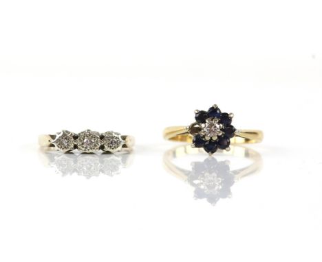 Two rings, including, a three stone illusion set diamond ring, in 9 ct white and yellow gold, ring size K, with a sapphire an