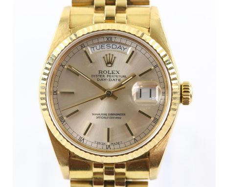 Rolex, reference 18030 gold Day Date oyster perpetual wristwatch, gold fluted bezel surmounting a silvered signed dial with g