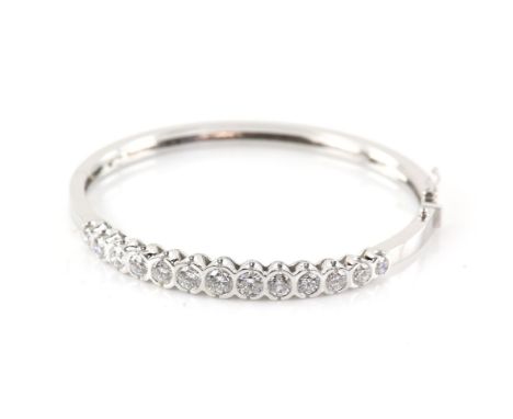 Diamond bangle, set with thirteen round brilliant cut diamonds, with a total estimated weight of 4.00 carat, in a rub over se