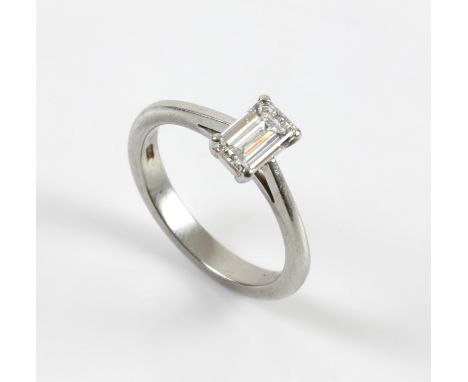 Modern diamond ring, central claw set emerald cut diamond, with copy of GIA diamond dossier, stating carat weight as 0.73 car