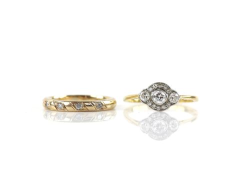 20th C diamond panel ring, with a central rub over set Old European cut diamond, with two other larger stones to the side and