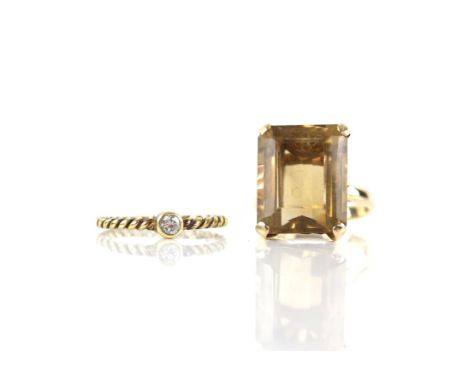 Two rings, including, a citrine cocktail ring, set with a step cut citrine, estimated weight 12.15 carats, in a four claw mou