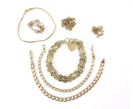 A mixed group of gold items, including a vintage gate bracelet, with heart padlock clasp, three flat curb link bracelets, two