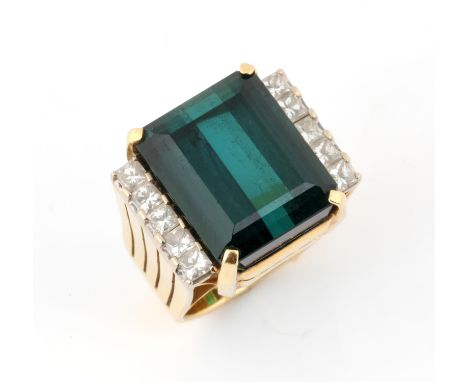 Contemporary tourmaline and diamond ring, with a rectangular step cut green tourmaline, estimated weight 16.72 carats, with t