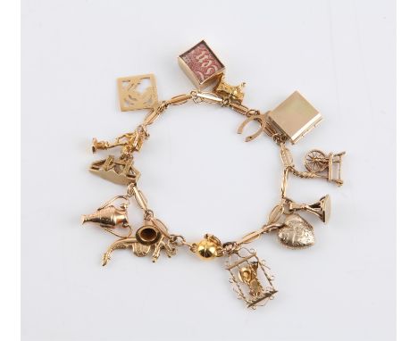 Vintage fancy link charm bracelet, with magnetic clasp and original bolt ring clasp, with fourteen charms attached, including