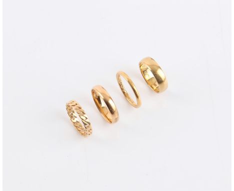 Four gold rings, two 22 ct yellow gold wedding bands, one 4mm in width, ring size N 1/2, the other is 2mm, inside is engraved