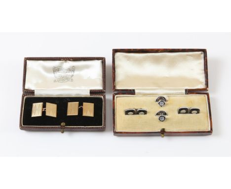 Pair of rectangular engine turned chain cufflinks, in 9 ct gold, hallmarked London 1953, in a fitted box by Bravingtons, with