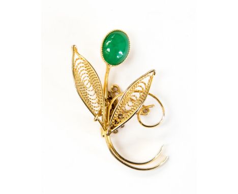 A Chinese gilt filigree and jade type brooch, in the form of a flower, the Imperial apple green colour cabouchon held in a mi