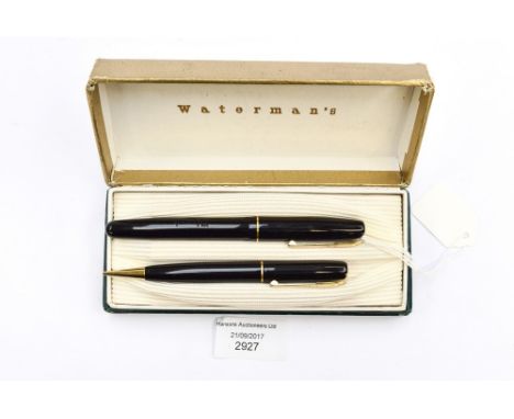 A boxed Watermans fountain pen and matching propelling pencil 4 W2-M with 14ct gold nib, black casing