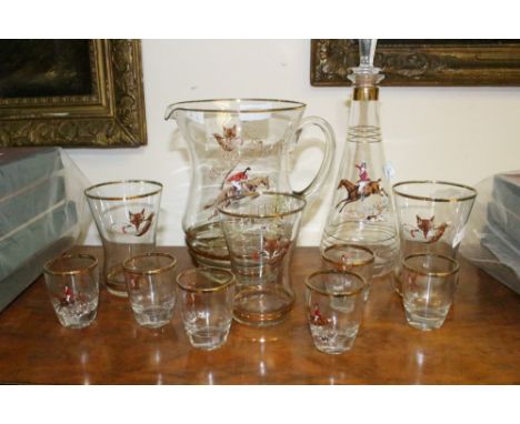 A set of Hunt themed glassware with painted decoration of Huntman and Foxes: Jug, decanter, three beakers and six shot glasse