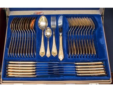 An attache case of Royal Collection solingen gilt series of flatware, fork missing and two teaspoons