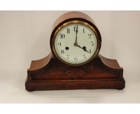 A 1920s Art Deco oak cased eight day mantle clock, white dial