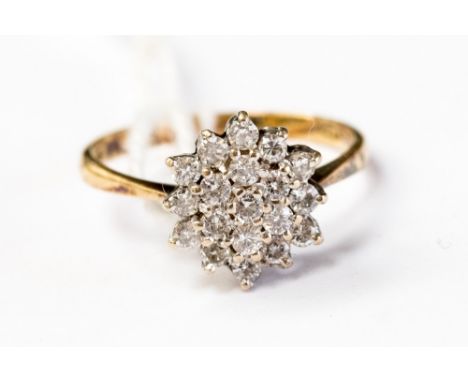 An 18ct gold and diamond cluster ring, the setting measuring approx 10mm,  size P1/2 with a total gross weight approx 3.2gms 