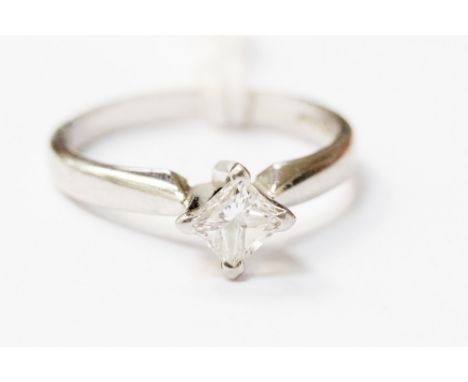 A platinum diamond ring, claw set with a princess cut diamond approx weight 0.44 carats, assessed colour F and  VVSI clarity,
