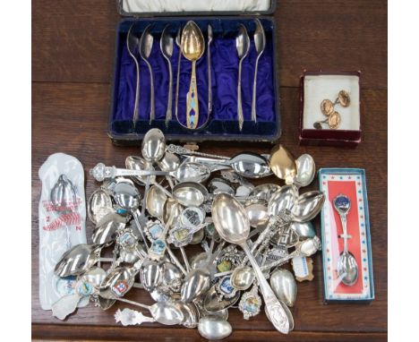 A cased part set of sterling hallmarked sugar tongs and spoons; together with a Russian enamel teaspoon, gold cufflinks and q