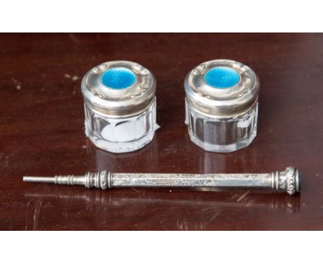 A pair of engine turned enamel topped dressing table jars, turquoise enamel, Birmingham 1911, together with silver white meta