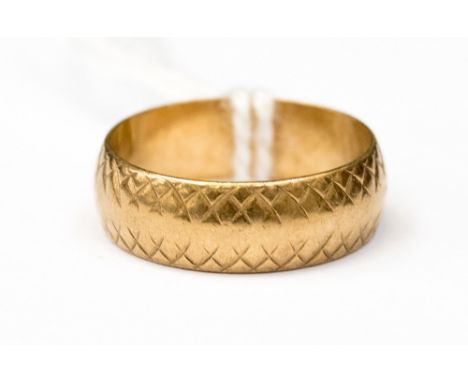 A 9ct gold wedding band, engraved cross design decoration, band width approx 5.5 mm, ring size L, approx 3.1 grams 