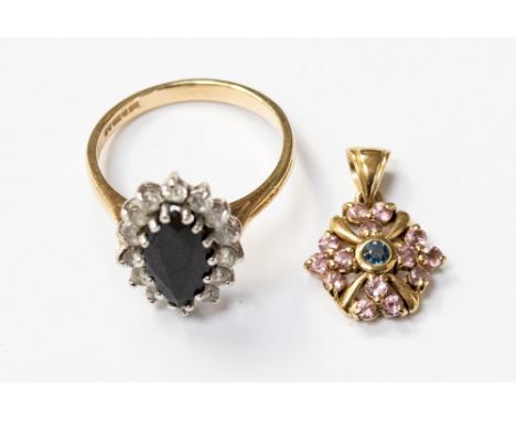 A 9ct gold dress ring with a marquise sapphire to the centre and white stone surround, size O, together with a 9ct pendant se