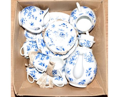 A 20th century oriental tea service for six including teapot, blue and white butterfly and insect floral decoration