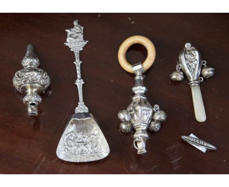 Three 19th Century silver baby's rattles, Birmingham and Chester hallmarks; together with silver 'baby' brooch and white meta