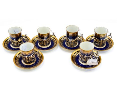 A set of 6 George Jones coffee cups and saucers, all cups set into solid silver holders, some af