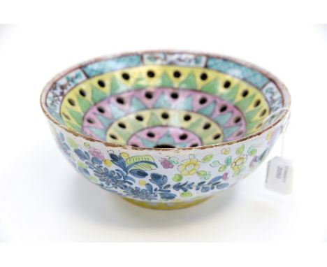 An English Delft ware Colander/ Drainer with later clobbered colourful enamel decoration, date circa 1750, size 22cm diam,   