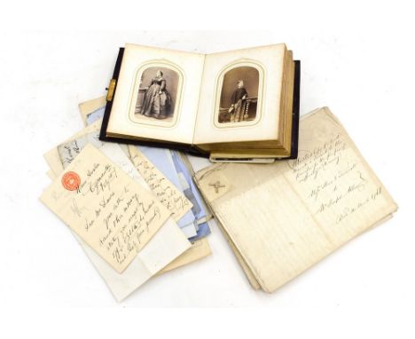 A Victorian photograph album with various portrait photographs, bound in leather, mounted in ivory and gilt; together with va