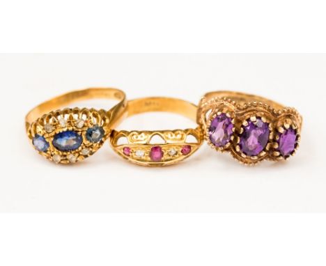 Three Venetian gold rings including an 18ct diamond and ruby boat ring, size L,  with an 18ct sapphire and white stone ring, 