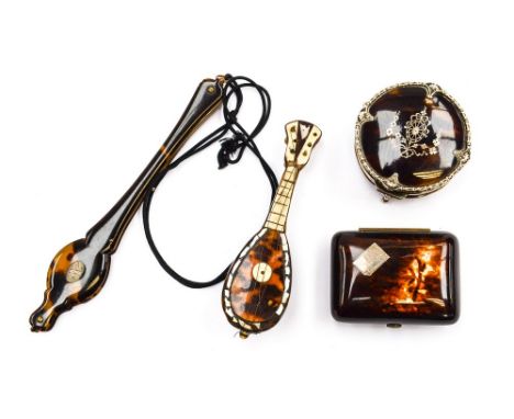 A group of tortoiseshell silver mounted items, comprising trinket pot and cover, purse, lunetts and banjo (on bag) 