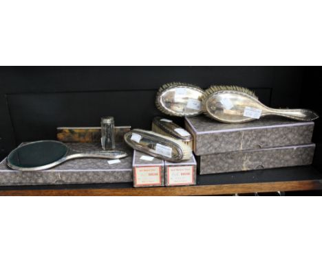 A five piece George V silver mounted dressing table set, engine turned comprising two pairs brushes and mirror, Birmingham 19