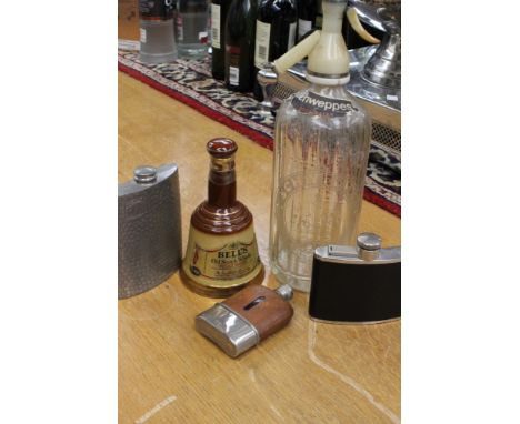 A 62/3 floz 70% Bells Whiskey (Wade Bell), a Schweppes soda water siphon, together with a pewter hip flask and two others (5)