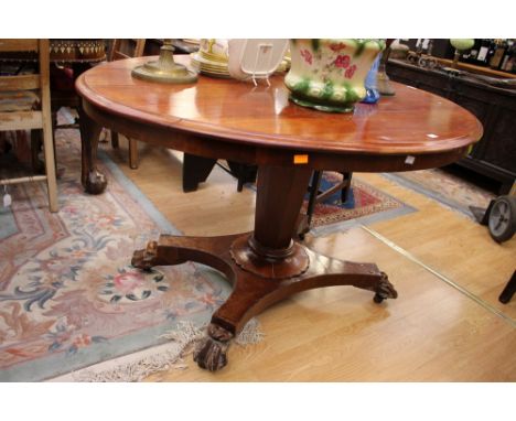 A 19th Century mahogany tilt top breakfast table, the top raised on an octagonal column and platform base; together with a co