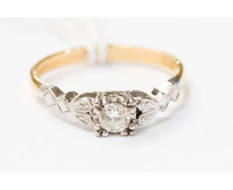 An 18ct gold, platinum and diamond ring, claw set whith a white setting,  size P, with a total gross weight approx 3gms
